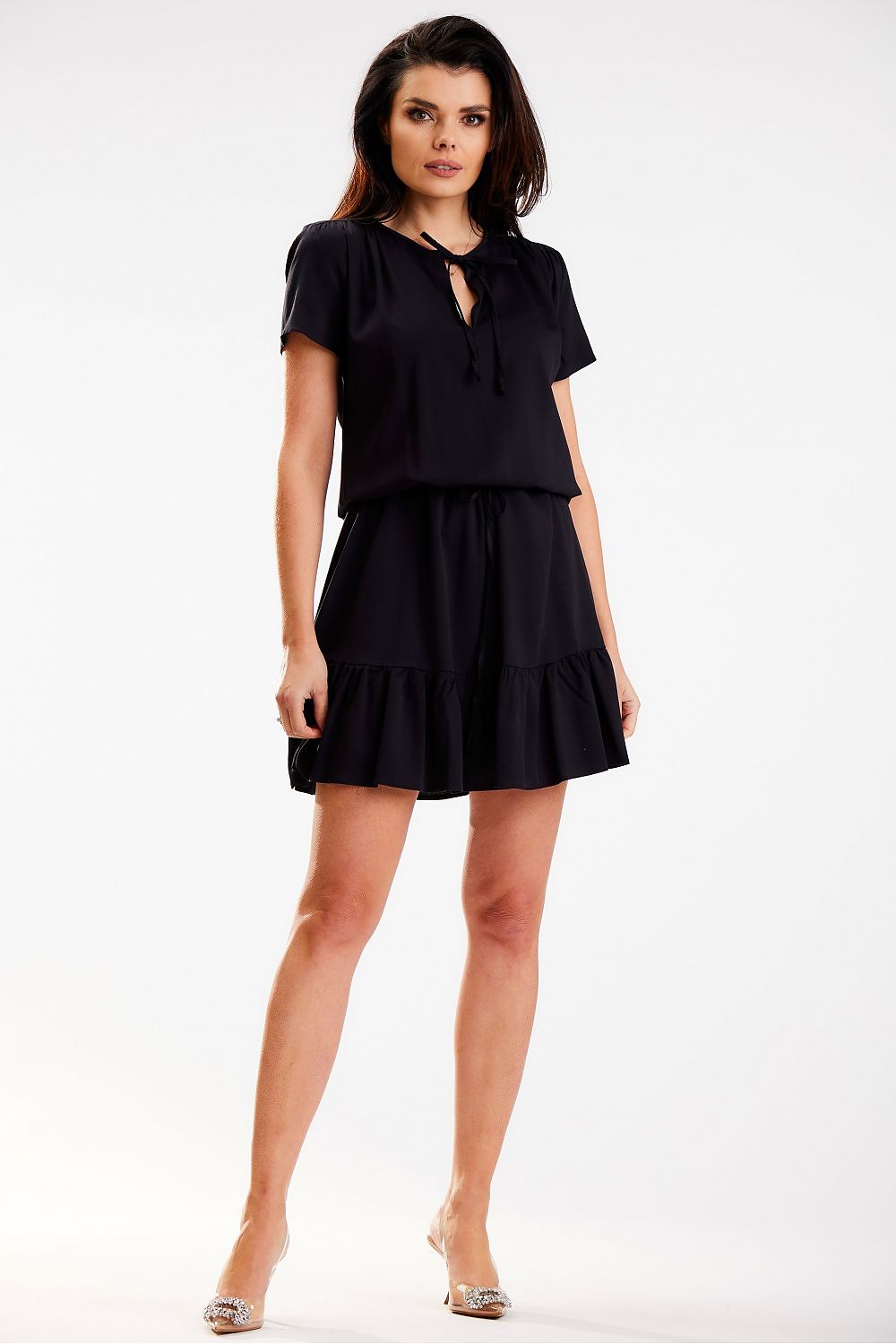 Fashionable black daydress by Awama, featuring short sleeves and a stylish ruffled hem, perfect for a sophisticated summer look.
