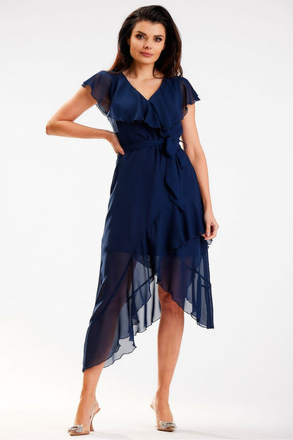 Elegant navy asymmetrical daydress with ruffle detail and V-neckline by Awama, perfect for sophisticated occasions. Model showcasing the dress with a graceful pose.