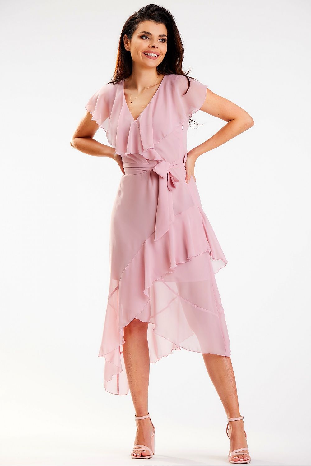 Charming pink asymmetrical daydress with ruffle detail and V-neckline by Awama, model exuding confidence and luxury in this timeless design.