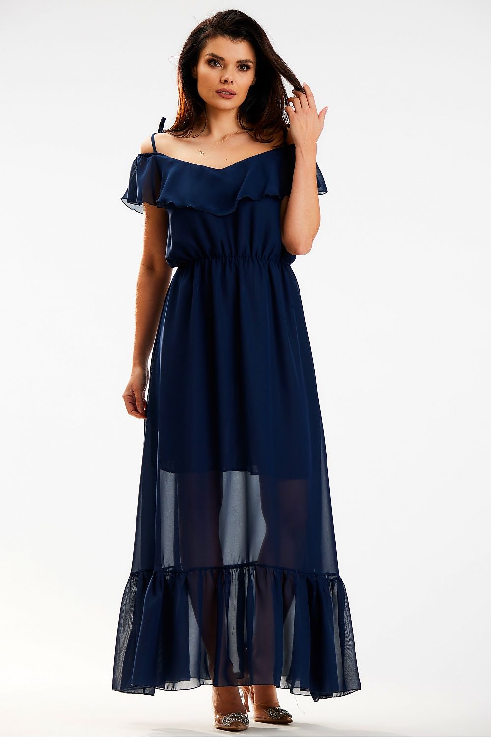Elegant Spanish-style maxi dress with ruffle and elastic waist in airy chiffon by Awama, showcased on a model standing elegantly, highlighting the graceful drape and sophisticated neckline.