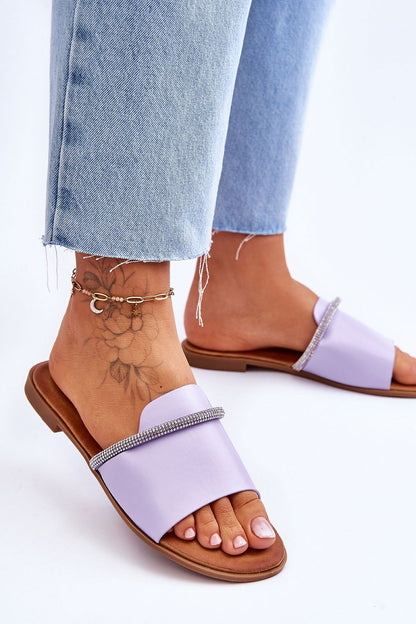 Luxury eco leather flip-flops from Step in Style featuring a chic rhinestone strap, perfectly paired with casual denim for a stylish summer look.