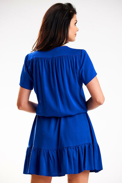 Back view of a luxurious blue chiffon daydress by Awama, showcasing the detailed ruffled hem and stylish shoulder design.