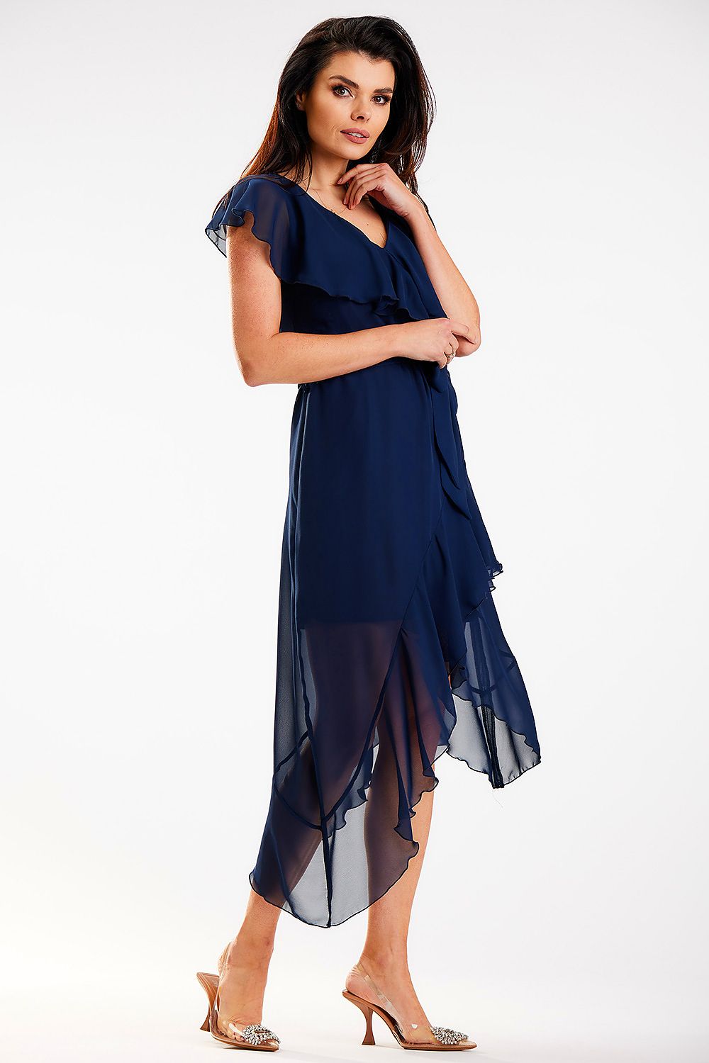 Side view of an elegant navy daydress with ruffle details and V-neckline by Awama, highlighting the flowing fabric and flattering silhouette.