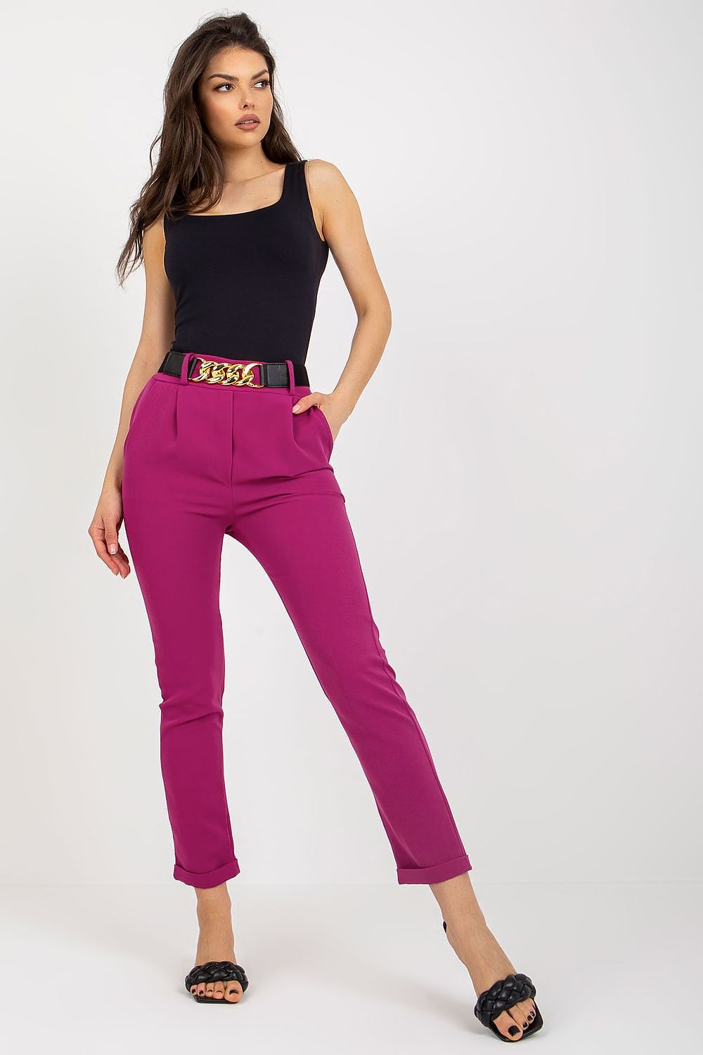 Luxury high rise trousers in vibrant magenta, featuring an elastic waistband and decorative belt, modelled by a woman by Italy Moda, perfect for evening wear or sophisticated office styles.