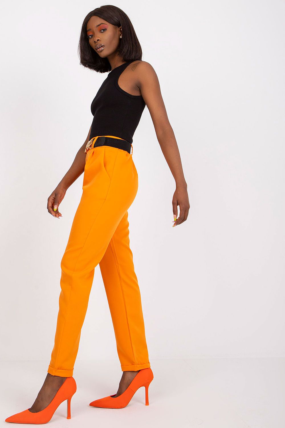 Fashion-forward orange trousers featuring a decorative belt, epitomising luxury style for women, created by Italy Moda.
