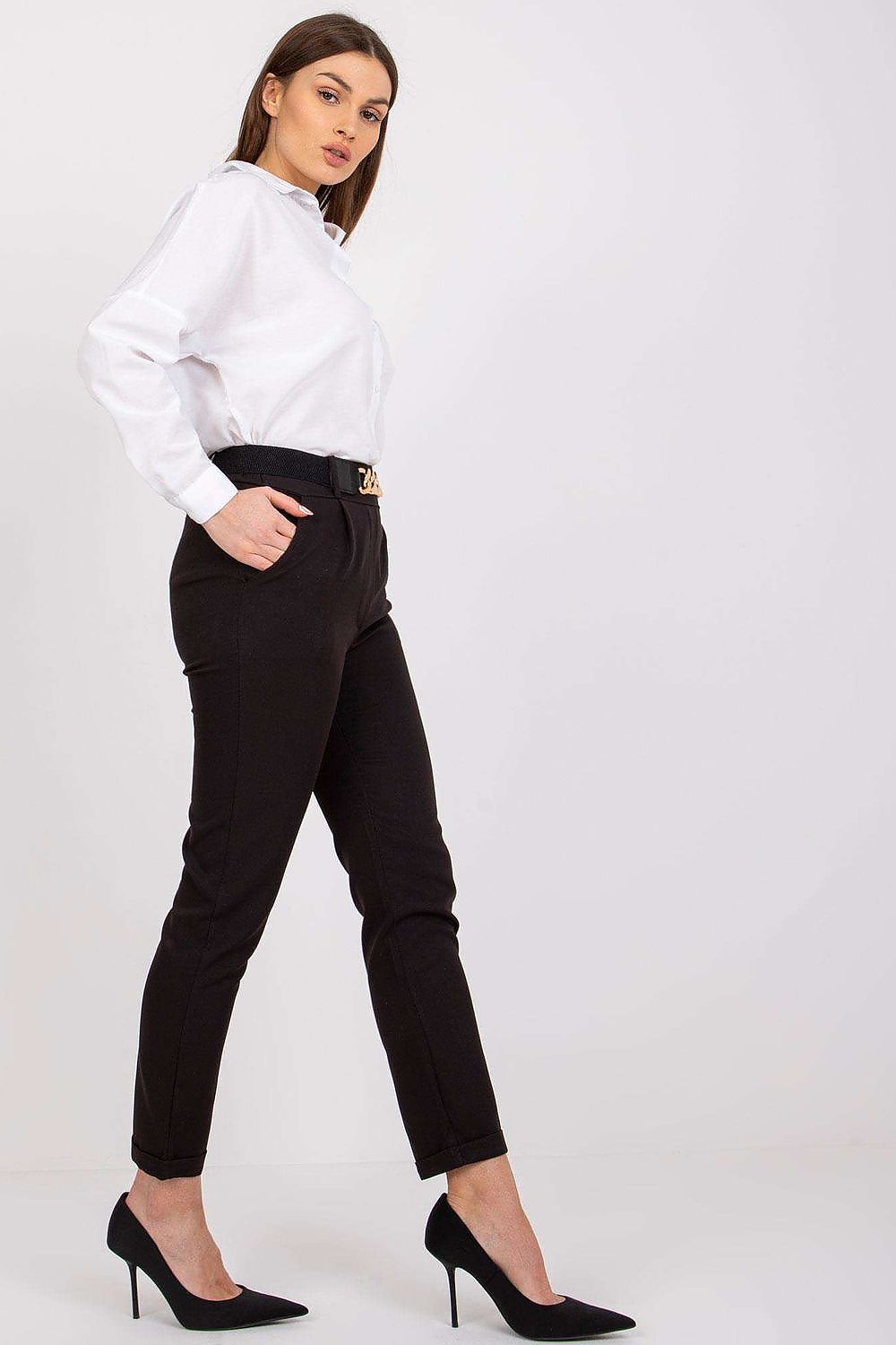 Side profile of a model in luxury women's black high rise trousers by Italy Moda, paired with a smart white shirt, exemplifying modern elegance.