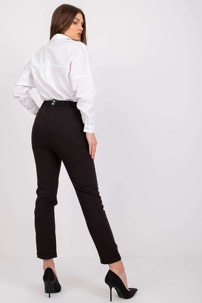 Elegant back view of a model wearing Luxury Women’s High Rise Trousers by Italy Moda, featuring an elastic waistband and decorative belt, styled with a crisp white shirt.