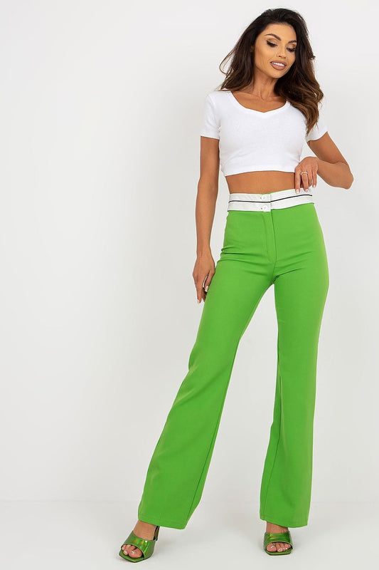 Elegant woman modeling Italy Moda's high-waisted straight cut trousers in vibrant green, paired with a chic white crop top and stylish green heels, showcasing a sophisticated and trendy ensemble perfect for luxury fashion.