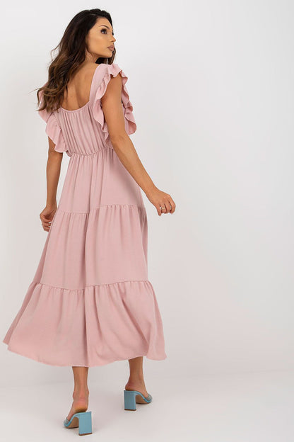 Back view of an elegant pink summer dress by Italy Moda, showcasing ruffled sleeves and a tiered design, ideal for chic summer outings.