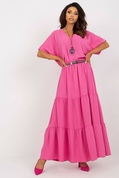 Exquisite long summer skirt in vibrant pink by Italy Moda, adorned with decorative frills and complemented by a stylish matching belt, perfect for chic summer occasions.