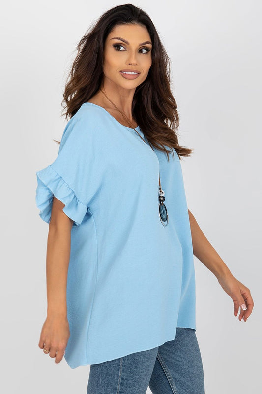 Side view of Italy Moda loose-fit blue blouse with frill sleeves, showcasing its relaxed silhouette and stylish neckline, complemented by a fashionable necklace.