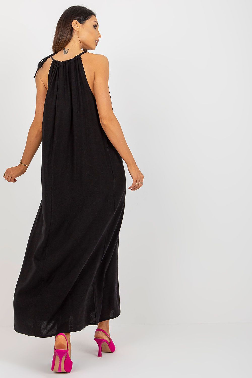 Sophisticated back view of a summer long dress from Och Bella, showcasing the flowing design and tied straps.
