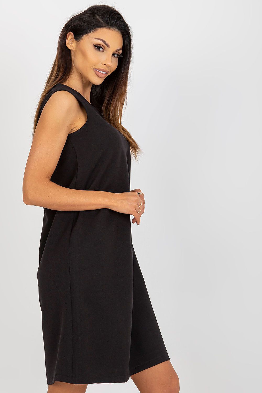 Side view of the luxurious black sleeveless daydress by Och Bella, showcasing its minimalist design and flattering silhouette.