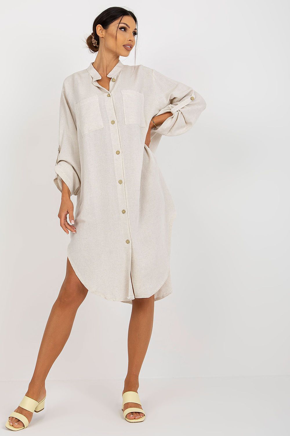 Luxury Och Bella shirt-cut dress in elegant beige with long sleeves, button-down design, and front pockets, styled effortlessly for a chic look.