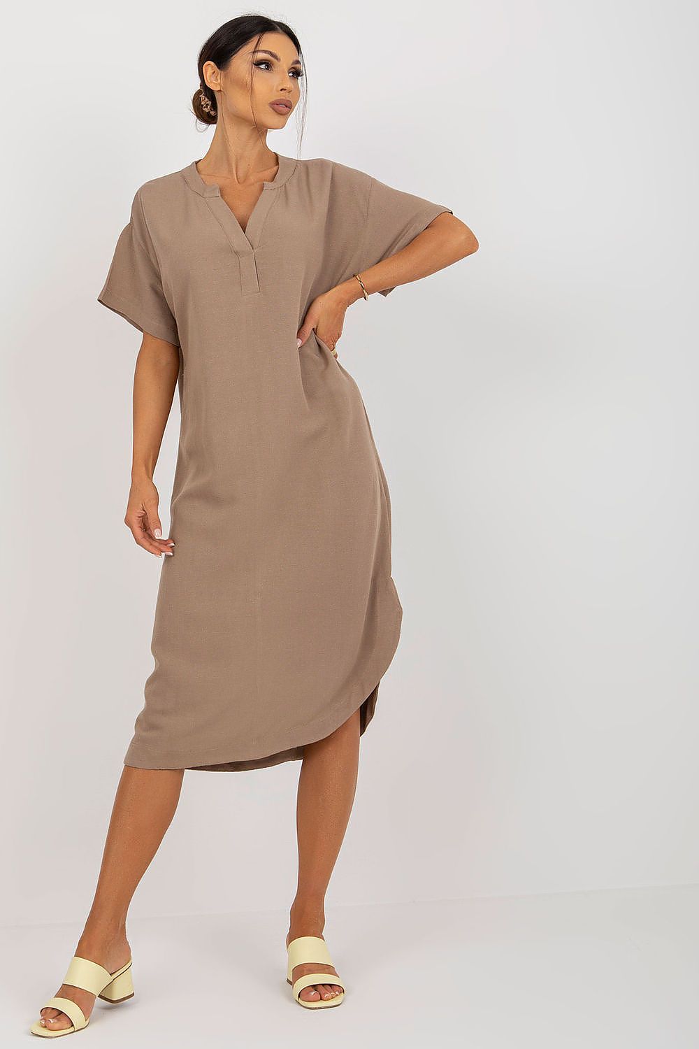 Stylish Och Bella shirt dress featuring a heart neckline and side slit, crafted from a luxurious cotton, linen, and viscose blend. Model poses elegantly, showcasing the chic design.