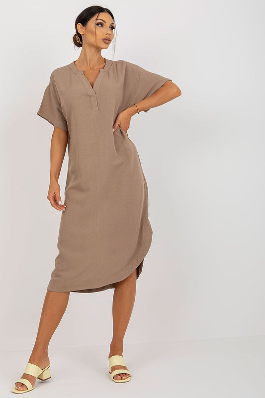 Stylish Och Bella shirt dress featuring a heart neckline and side slit, crafted from a luxurious cotton, linen, and viscose blend. Model poses elegantly, showcasing the chic design.