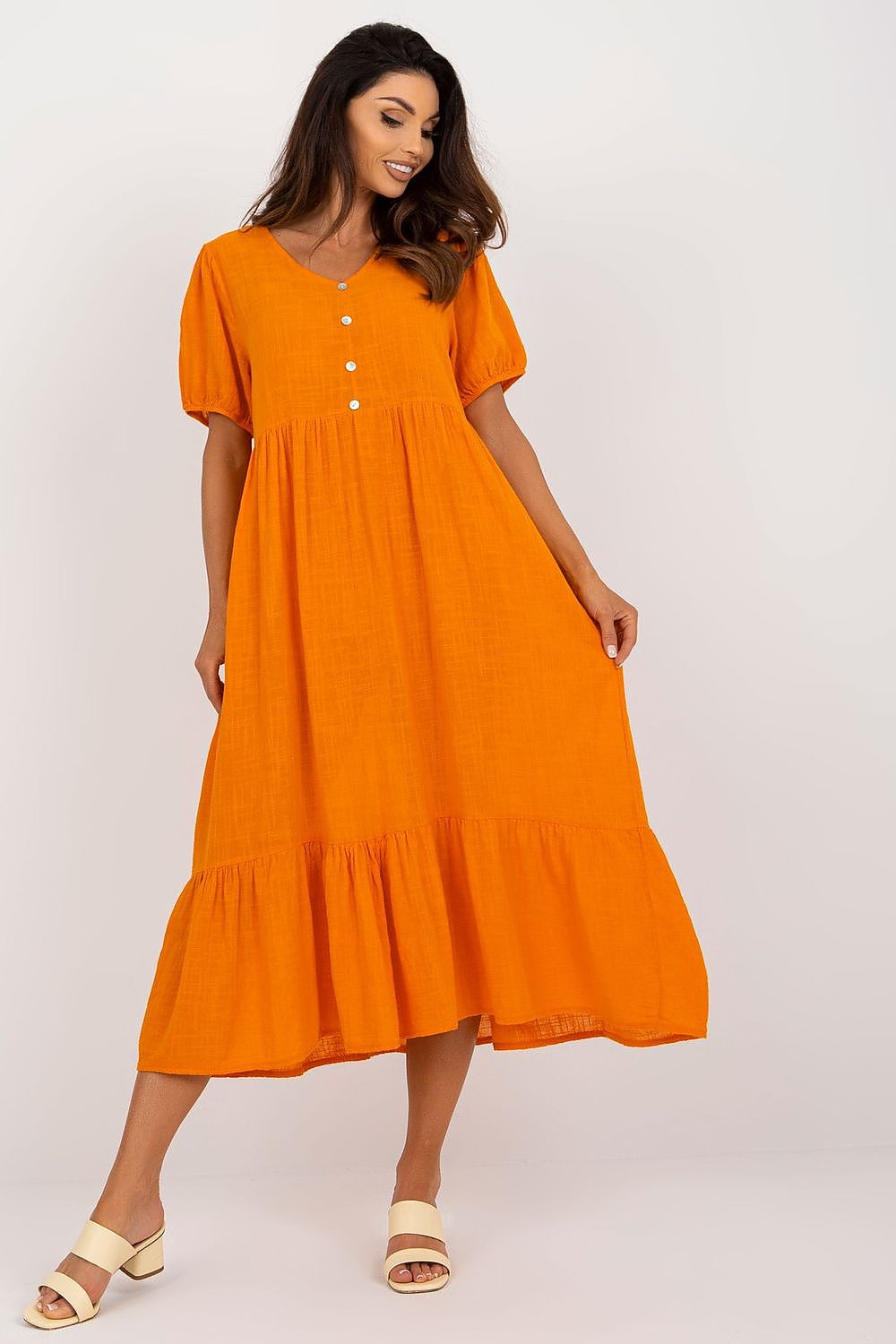 Chic and sophisticated orange Och Bella short sleeve daydress featuring a ruffle hem and heart neckline, perfect for casual outings.