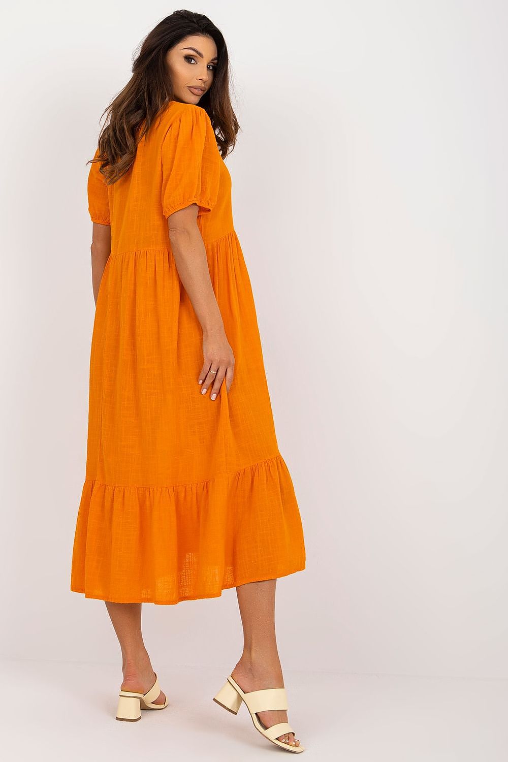 Exquisite rear view of the Och Bella orange daydress, highlighting its ruffle detail and relaxed fit, ideal for a luxurious casual look.
