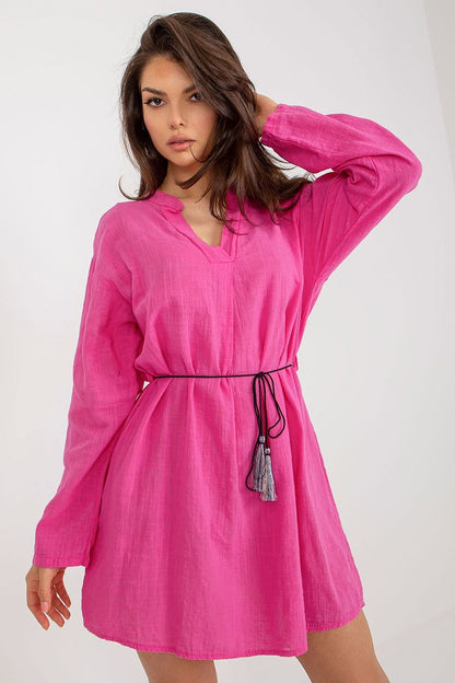 Elegant pink cotton daydress with long sleeves, featuring a drawstring waist. Styled by Och Bella for a chic casual look.