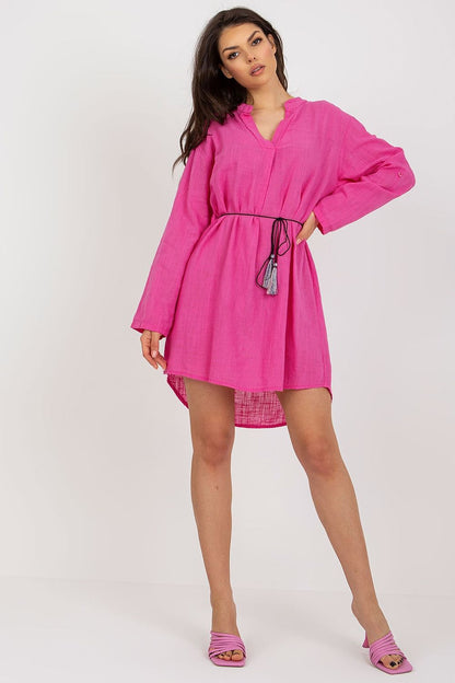 Sophisticated pink cotton daydress with long sleeves and a drawstring waist, modelled by Och Bella for a stylish casual ensemble.