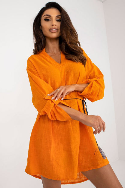 Glamorous Och Bella cotton daydress in stunning orange with long sleeves and drawstring waist, highlighting a chic front view, ideal for sophisticated casual outings.