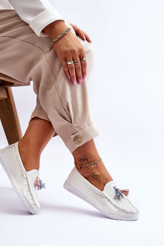 Elegant moccasin flats for women designed by Step in Style, featuring natural leather, stylish tassels, and a comfortable non-slip sole.