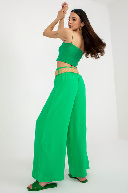 Italy Moda Women's High Rise Wide Leg Trousers, showcasing elegant decorative creases and a matching belt on a stylish background.