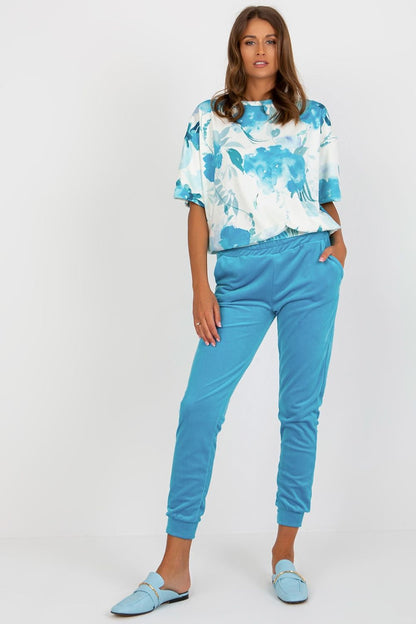 Luxurious velour blouse and high-waisted pants set by Rue Paris, showcasing elegant design with comfortable fabric for stylish fashion.
