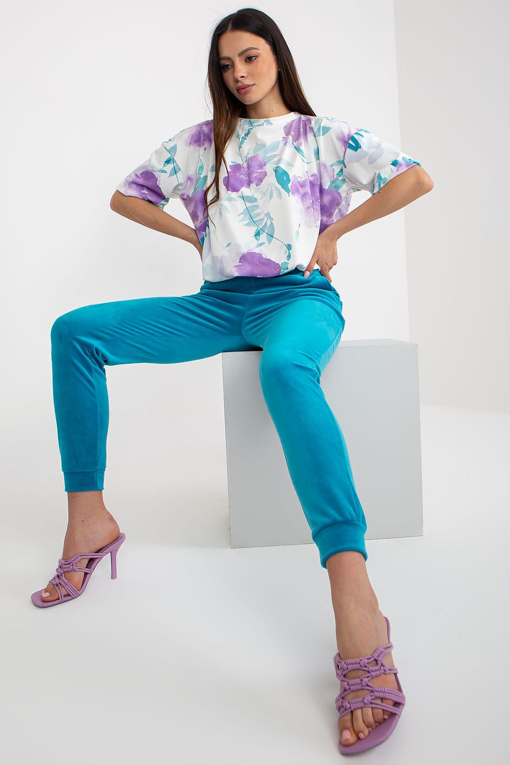 Elegant ensemble featuring velour blouse and tailored high-waisted pants by Rue Paris, ideal for sophisticated fashion lovers.