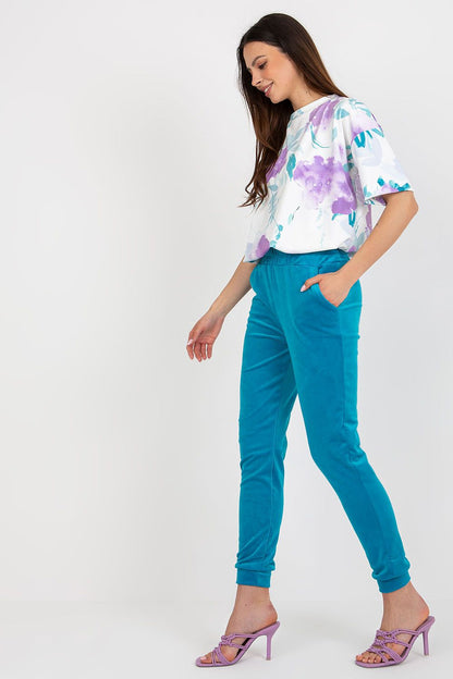 Luxurious velour blouse and high-waisted pants set by Rue Paris, showcasing elegant design and comfortable fabric.