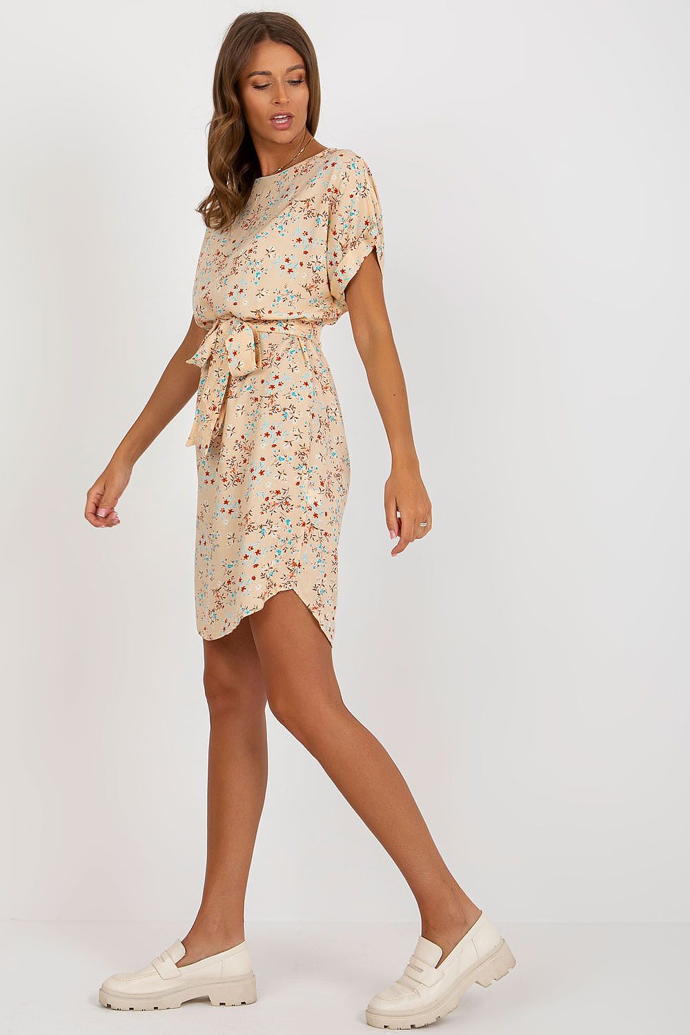 Chic short-sleeved summer dress in vibrant floral patterns, expertly crafted by Rue Paris, featuring a flattering belted waist for an elegant fit.