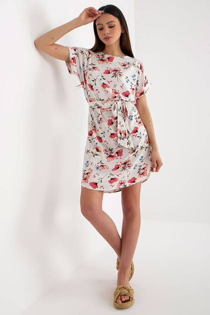 Sophisticated summer dress by Rue Paris with intricate floral designs, short sleeves, and a charming belt, perfect for upscale summer gatherings.
