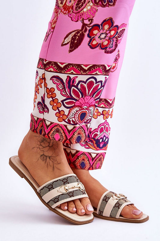 Stylish luxury eco-friendly leather flip-flops featuring a comfortable 1.5cm heel, paired with vibrant floral-patterned trousers from Step in Style.