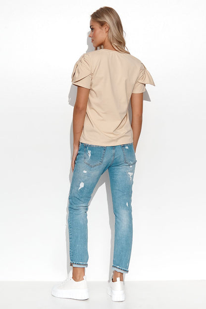 Elegant Makadamia women's blouse featuring a heart neckline, stylish sleeves, and a decorative gold plate, perfect for sophisticated styling.