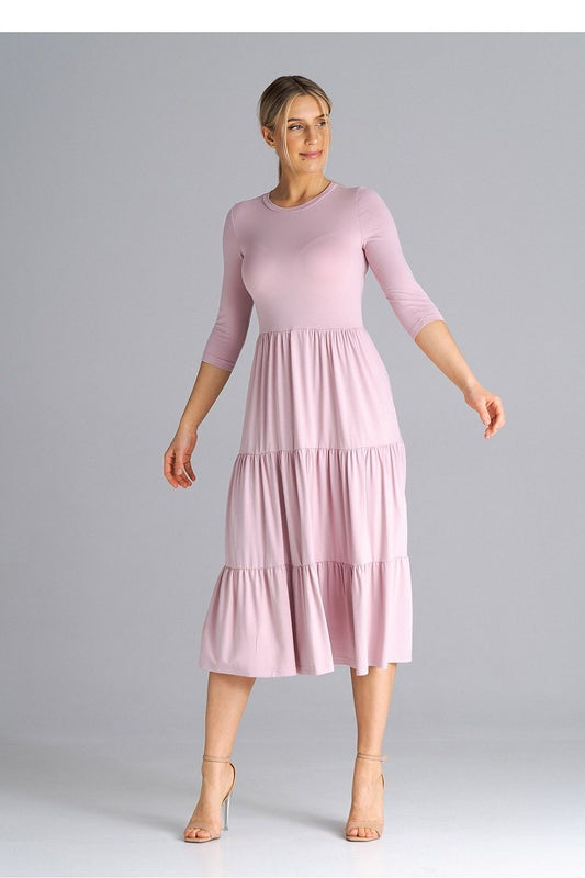 Classic and stylish Figl dress with a fitted waist and luxurious ruffled details, ideal for modern elegance.