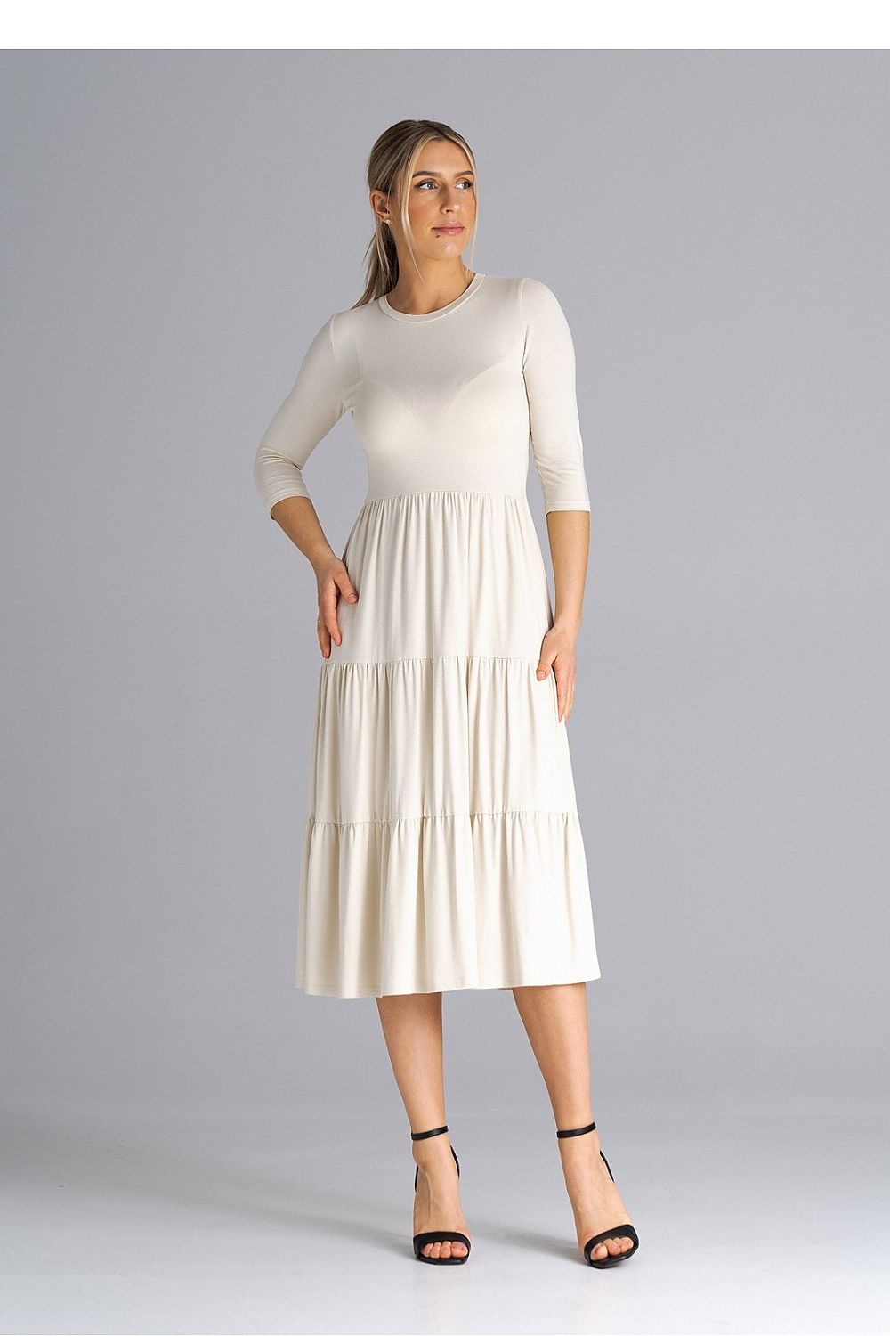 Elegant Figl midi dress featuring 3/4 sleeves, a fitted waist, and luxurious crinkled ruffles, perfect for upscale occasions.