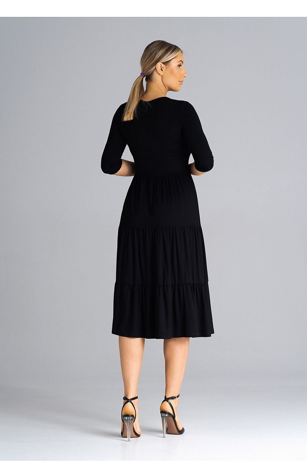 Chic Figl midi dress showcasing refined 3/4 sleeves and sumptuous fabric design, ideal for upscale events.