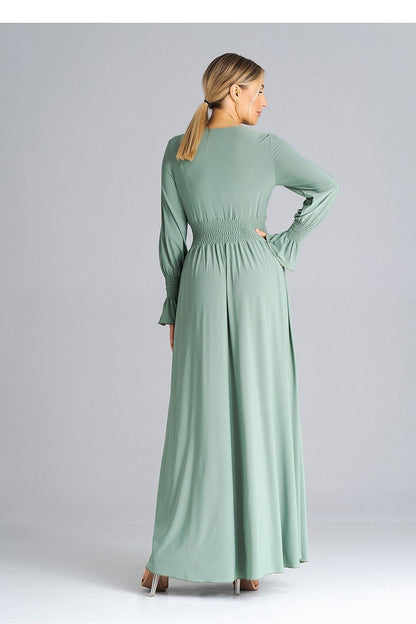 Stylish side view of Figl Elegant Maxi Dress, highlighting the waist crinkle and alluring leg slit for added elegance.