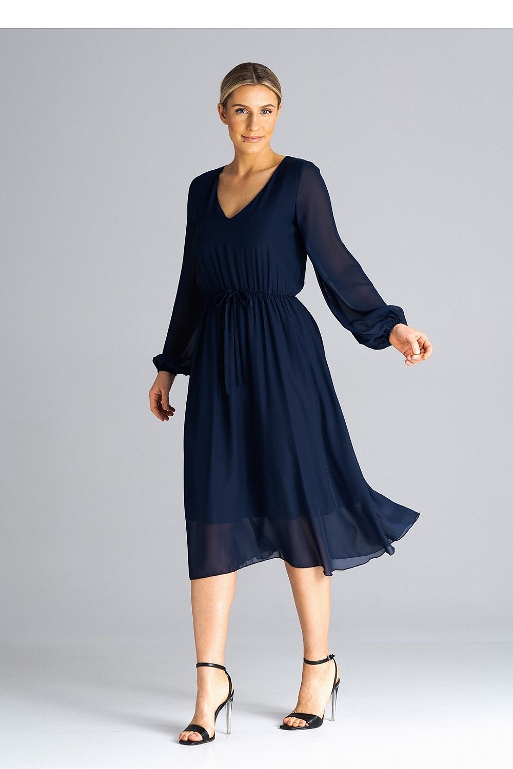 Elegant flared daydress by Figl, featuring long sleeves, a pleated waist, and a chic neckline, perfect for sophisticated everyday wear.