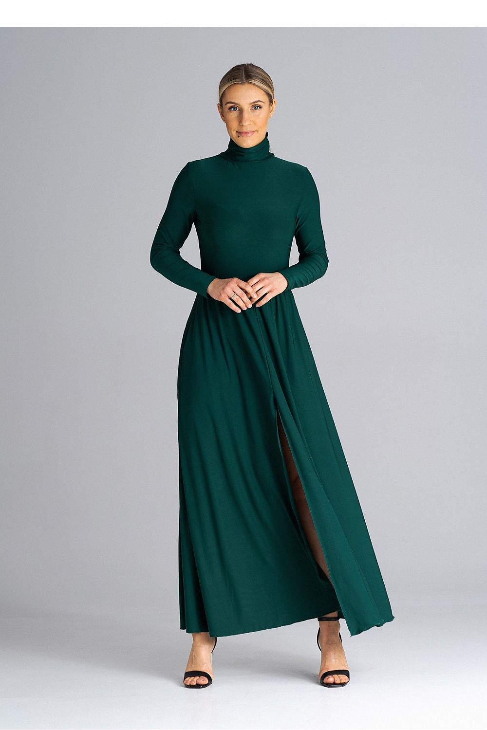 Elegant Figl maxi dress with turtleneck and flared hem design, perfect for sophisticated occasions, showcased in a luxurious setting.