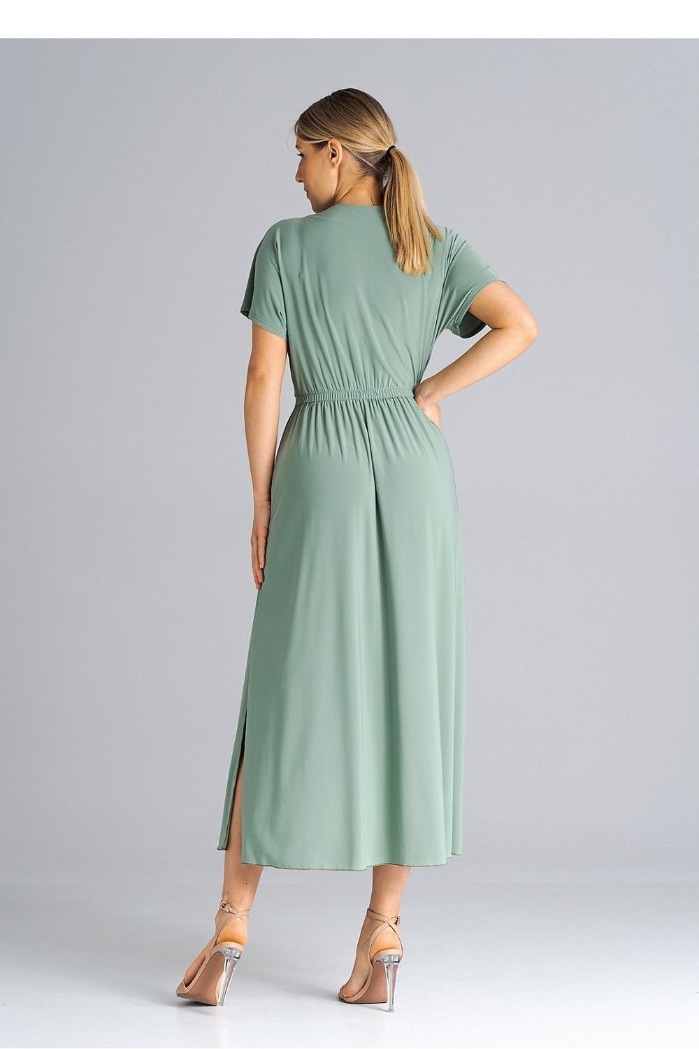 Side view of Figl Elegant Daydress with unique side cracks and elegant drooping sleeves, a statement piece for any sophisticated wardrobe.