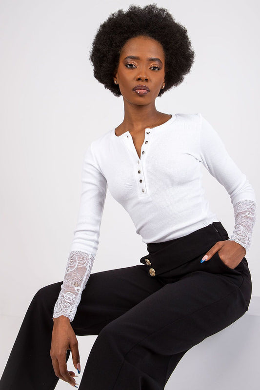 Elegant ribbed blouse with lace detail by Rue Paris, showcasing a luxurious design perfect for both casual and chic occasions.