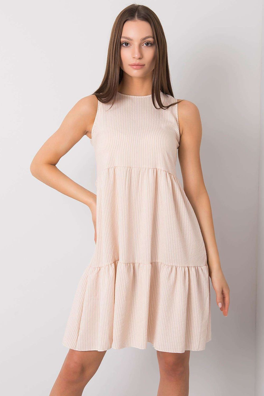 Elegant beige cotton daydress by Rue Paris featuring a stylish ruffle hem and a discreet covered zipper, perfect for sophisticated everyday wear.