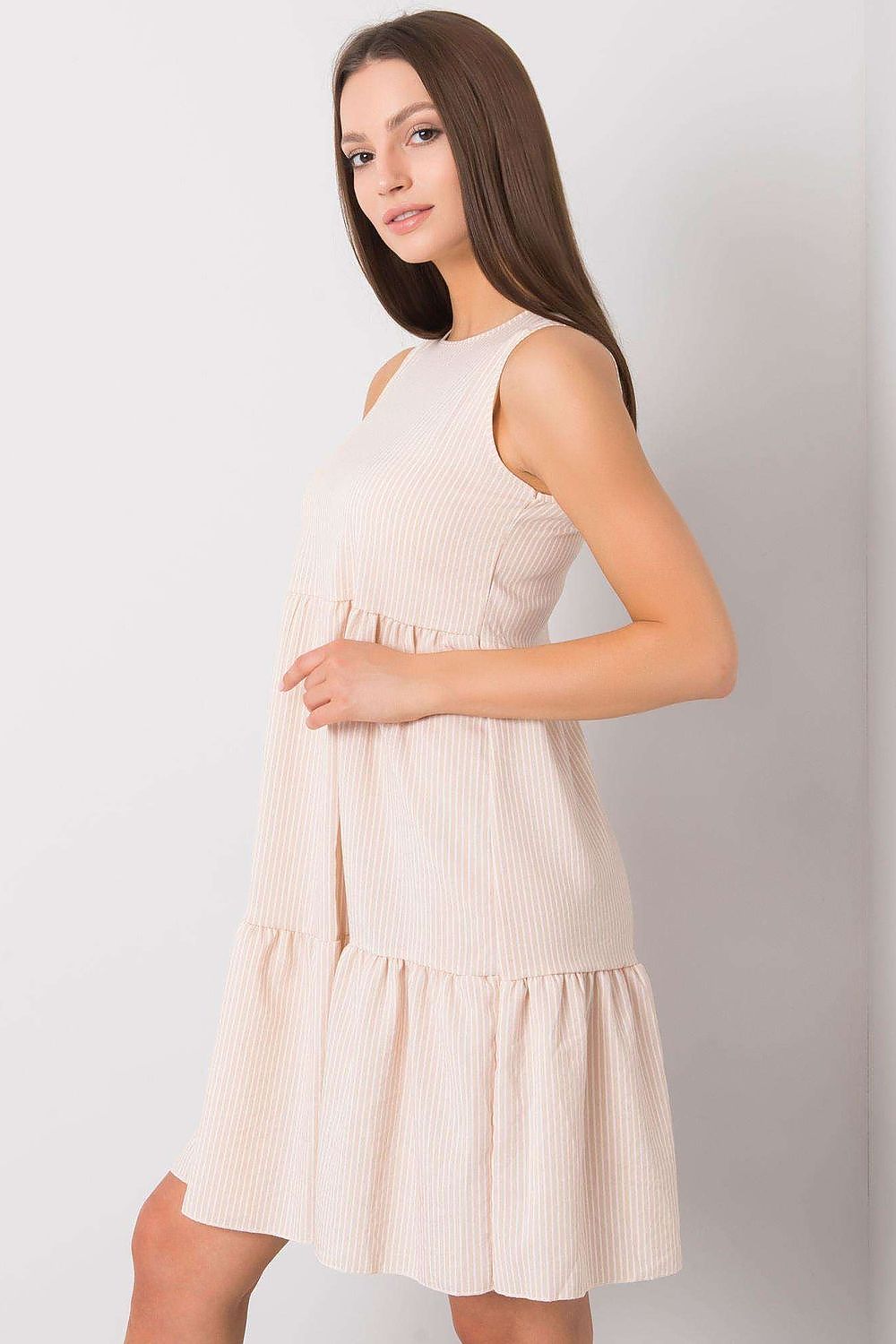 Elegant beige cotton daydress with ruffle hem and covered zipper by Rue Paris, showcasing luxurious design and quality craftsmanship.