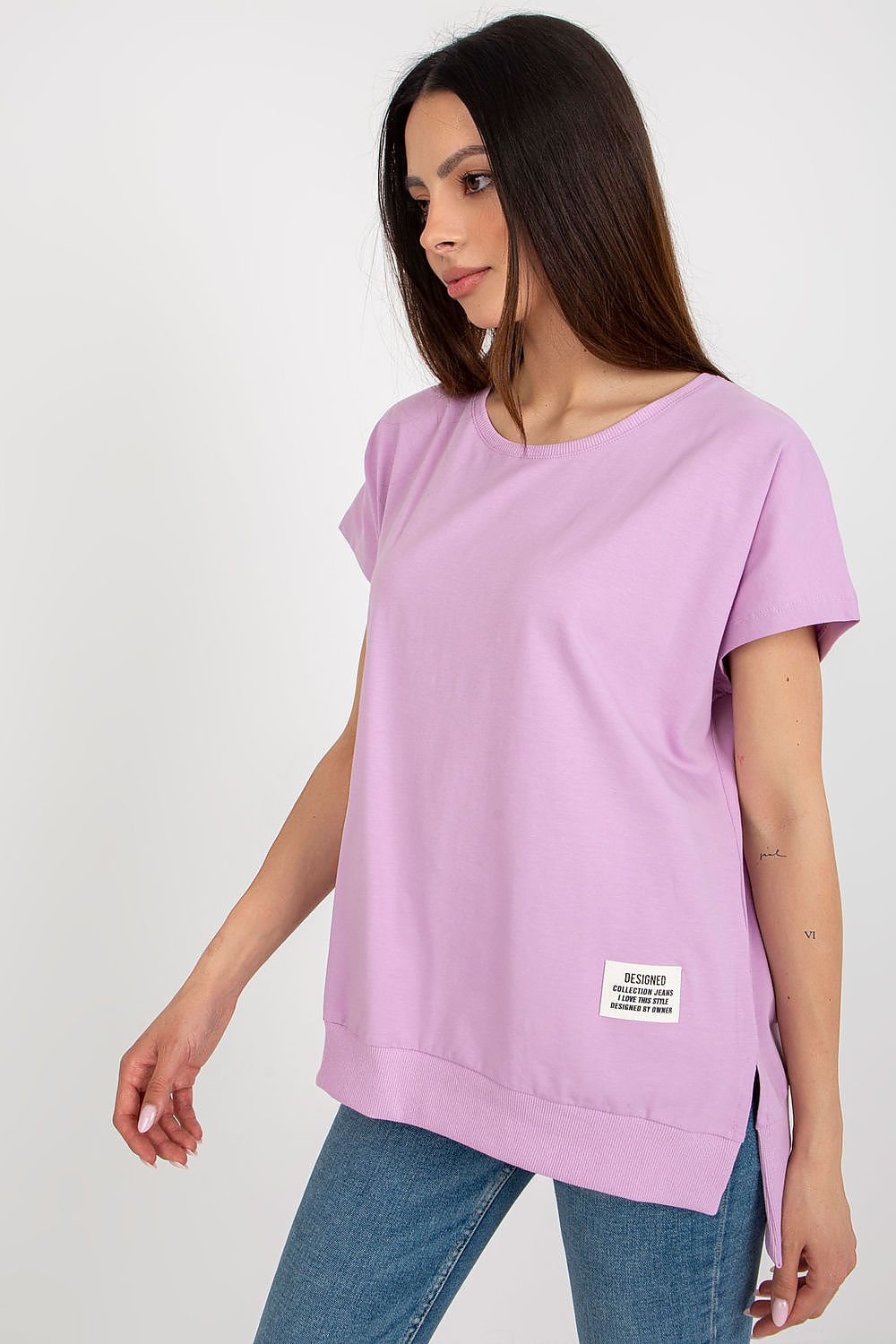 Elegant women's blouse in a loose fit style, showcasing a beautiful decorative patch, designed by Relevance in a comfortable cotton-spandex fabric.