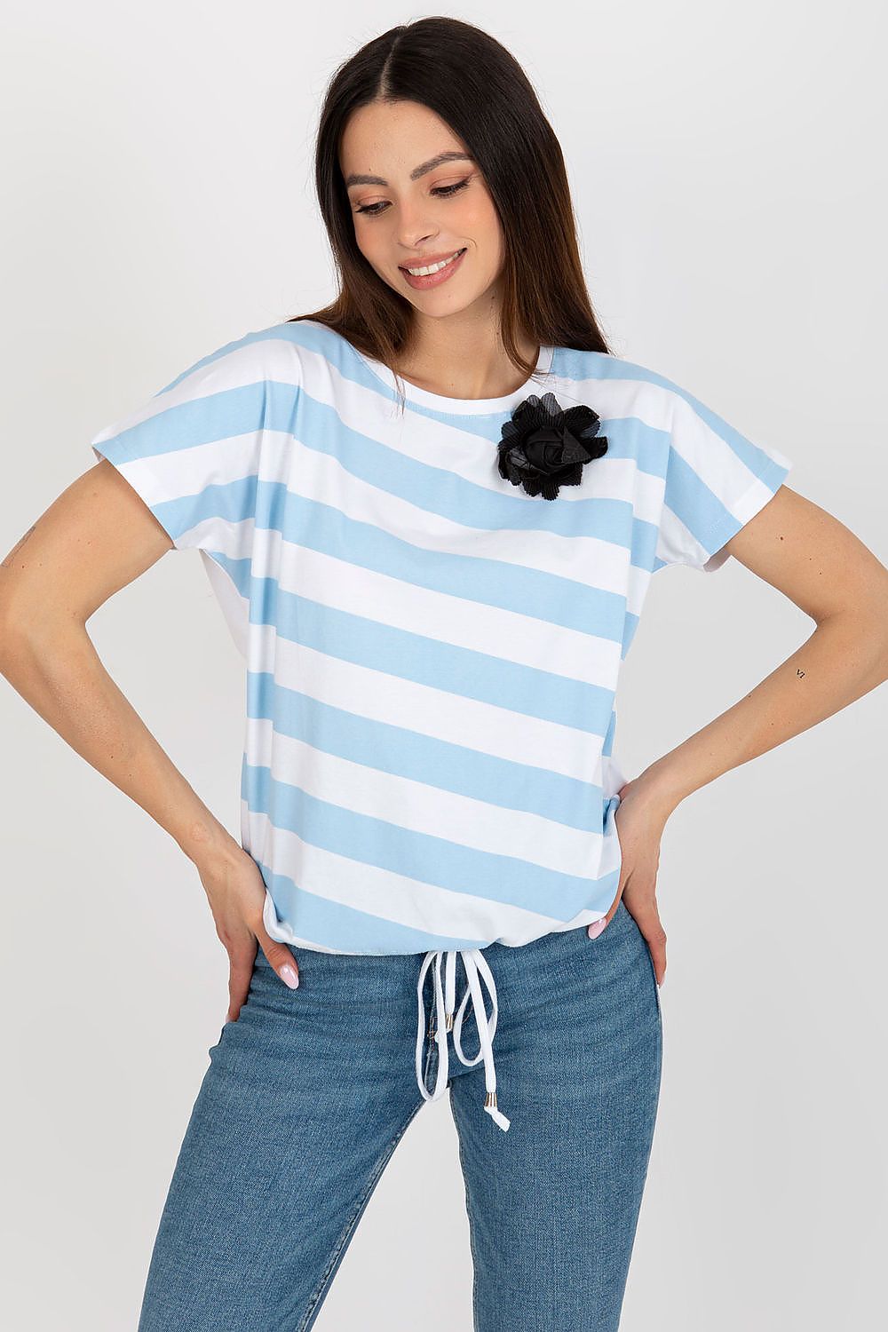 Stylish women’s blouse crafted from a soft cotton blend by Relevance, highlighted with a charming flower brooch.