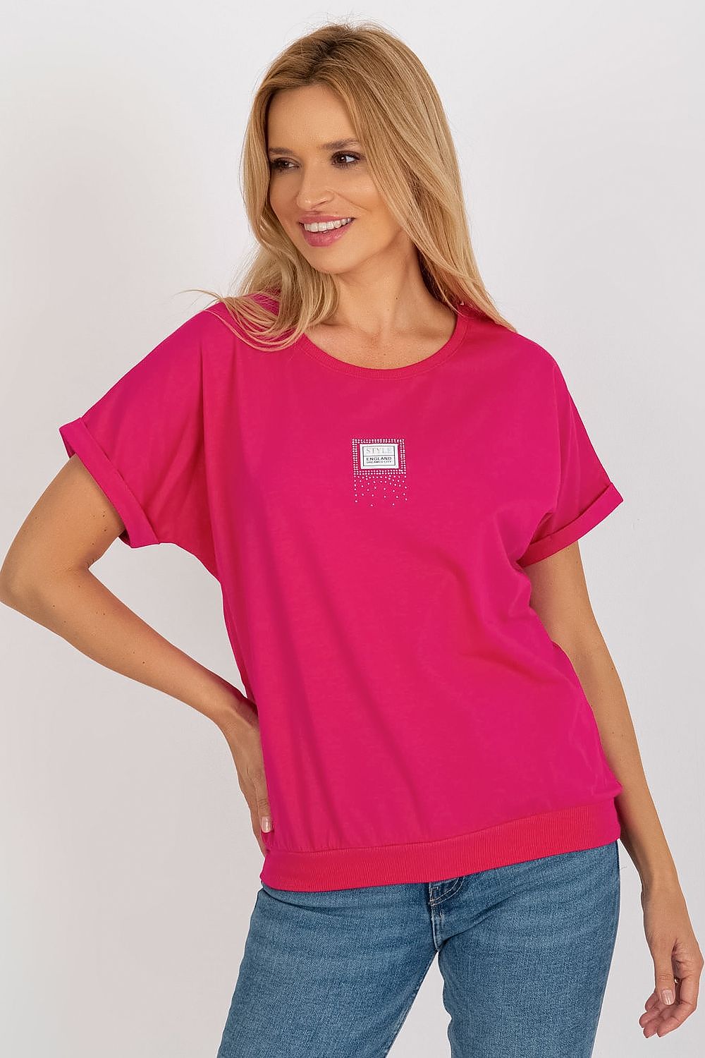 Stylish women's short sleeve blouse with a round neckline and decorative patch, designed by Relevance for an upscale wardrobe.