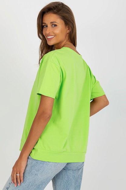 Model wearing an Elegant Women's Short Sleeve Blouse by Relevance, elegantly styled with a round neckline and short sleeves, perfect for chic summer attire.
