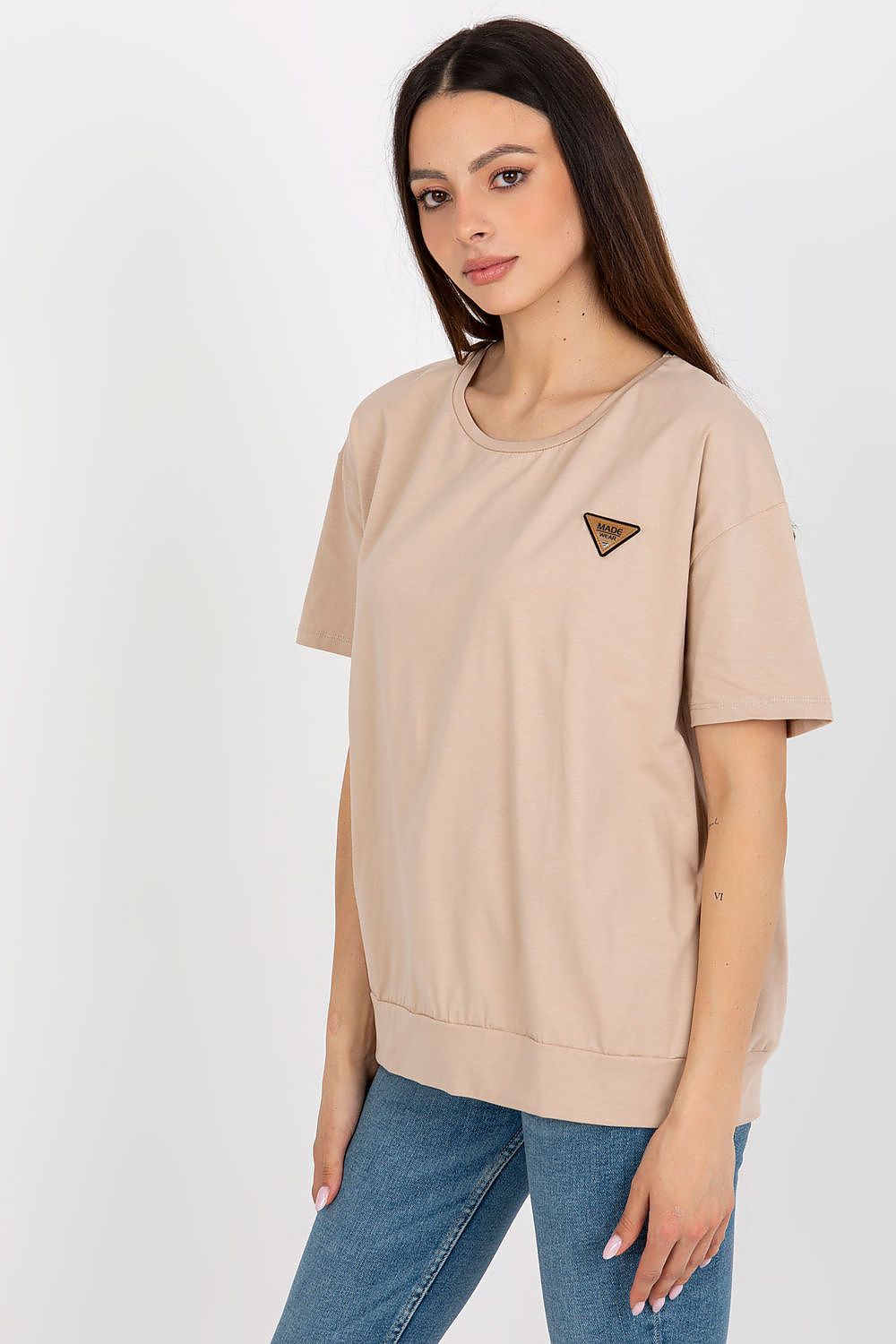 Luxury women's blouse with short sleeves, adorned with a decorative patch, made by Relevance from breathable cotton and spandex blend.