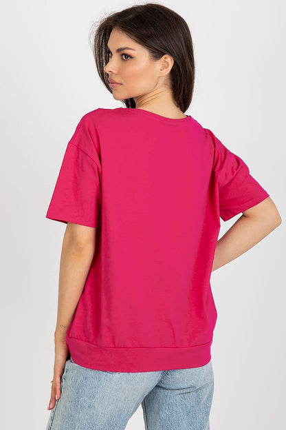 Close-up of Relevance women's short sleeve blouse showcasing the stylish decorative patch and high-quality fabric blend.